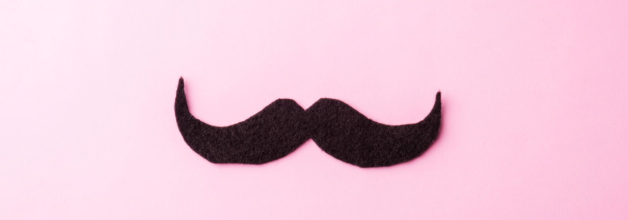 pink background with felt moustache in the centre