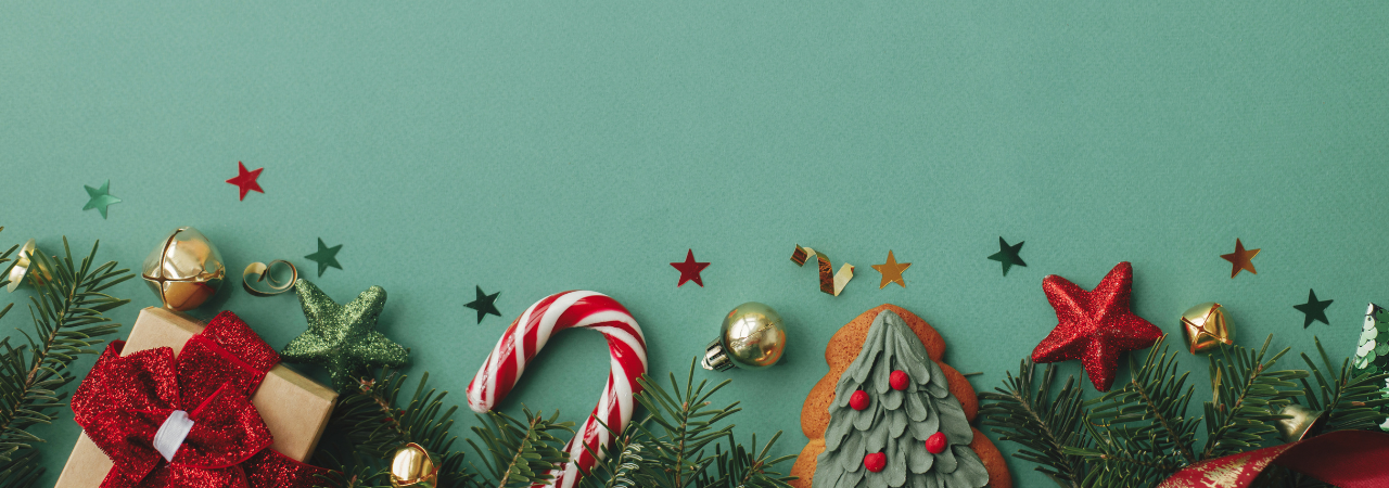 green background with star confetti, christmas tree sprigs, gift, christmas cookie, and candy cane sprinkled across bottom of image