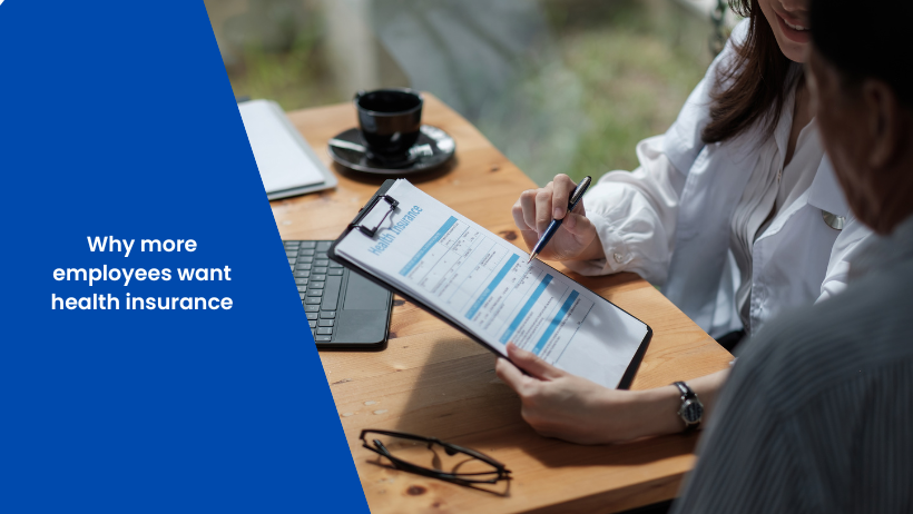 An image of a women holding a clip board and pen pointing at words to another person. On the left a blue overlay with the blog title "why more employees want health insurance"