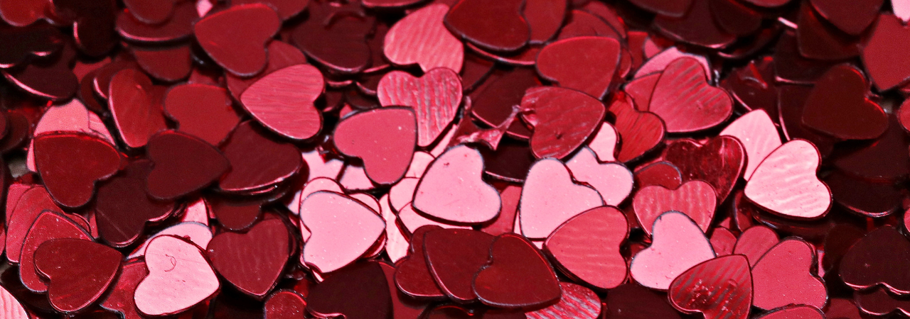 close up of red heart confetti